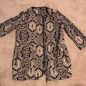 Light weight black and cream collarless coat